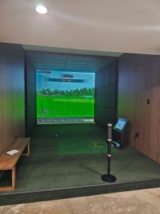 Commercial interior with golf simulator lounge