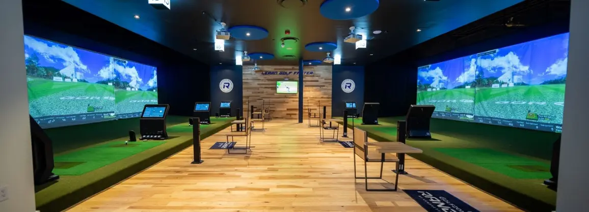 Indoor golf simulator facility demonstrating how golf simulators work with real-time swing analysis and virtual golf.